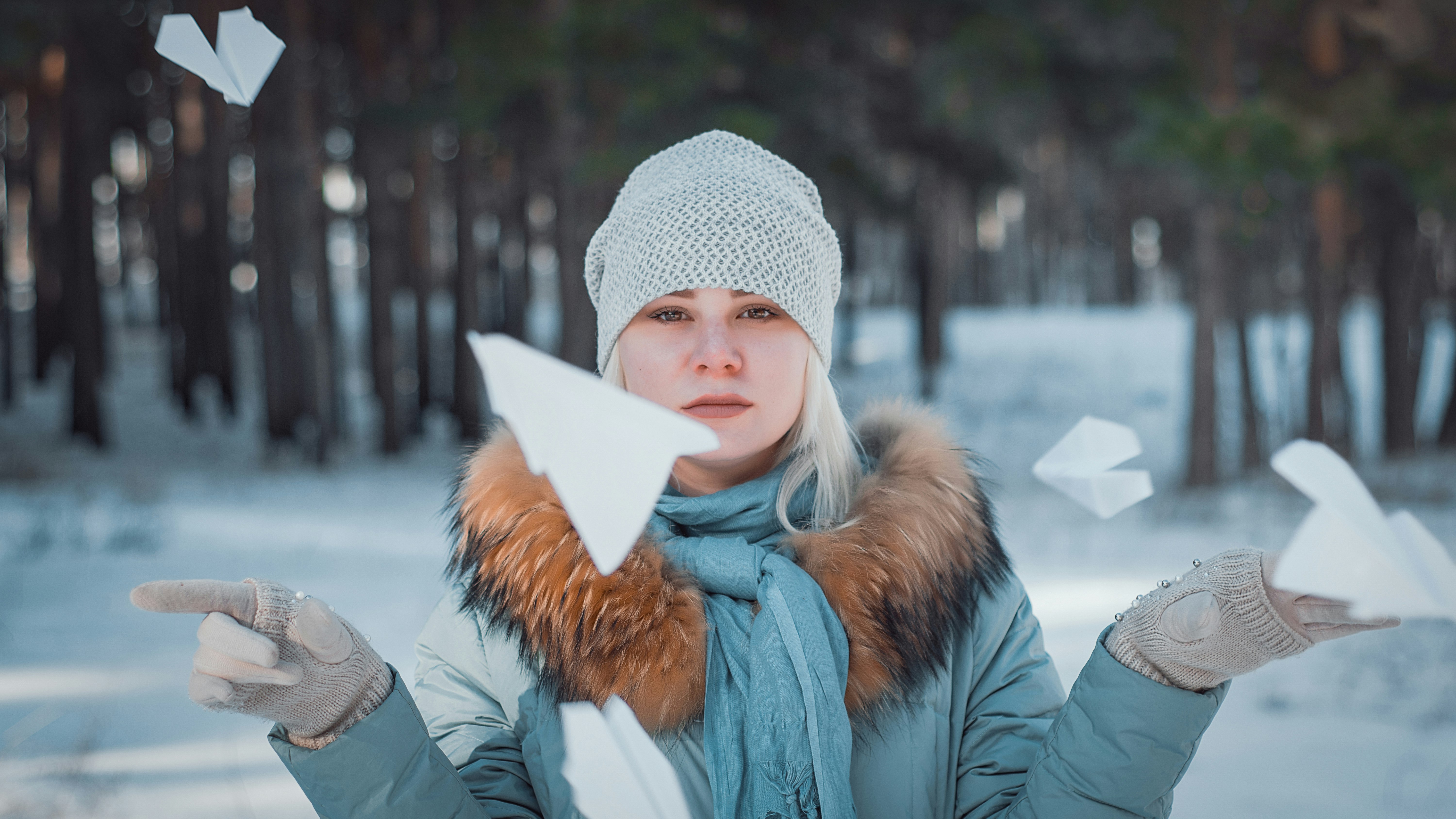 woman surrounded by flying paper plane